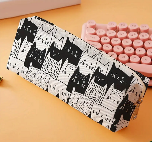 Pencil case with black cat pattern on a yellow surface