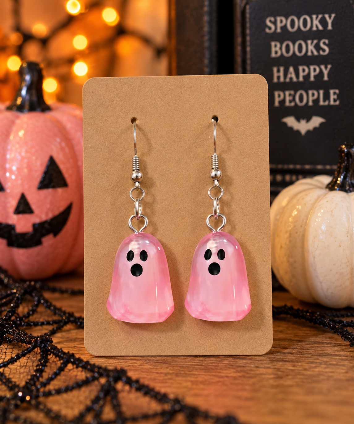 Pink translucent ghost dangle earrings with surprised faces