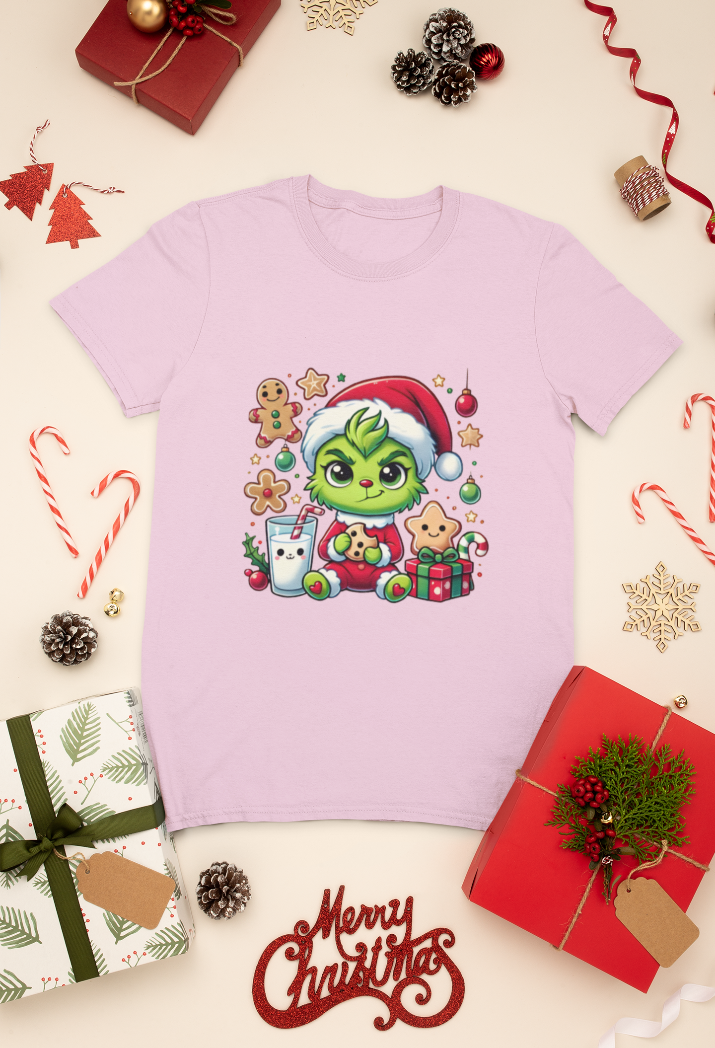 Child’s pink shirt with a baby Grinch eating a cookie and drinking milk, a festive holiday design.