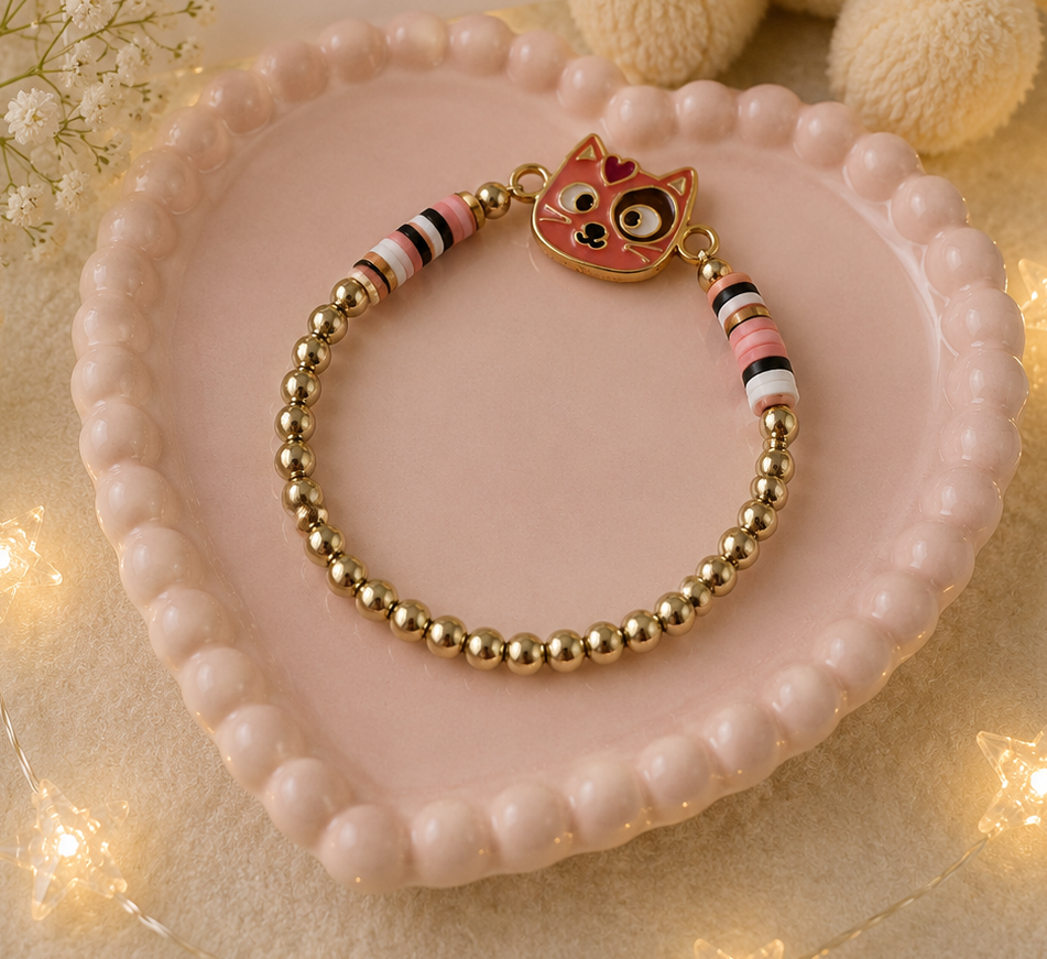 Pink cat charm bracelet with gold-tone elastic beads and pastel bead accents