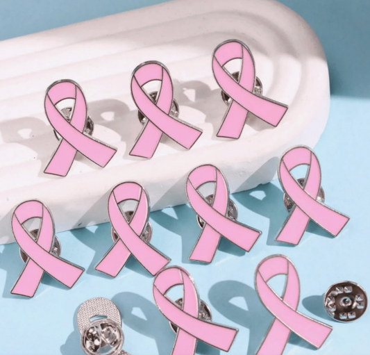Pink breast cancer awareness ribbons on a white background