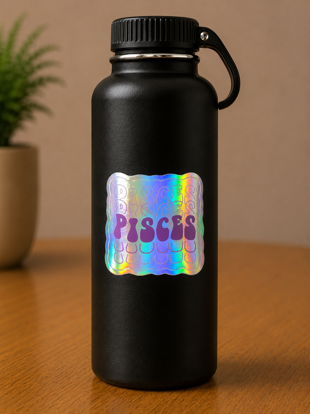 Pisces holographic zodiac sign vinyl sticker on a black insulated water bottle with retro typography.