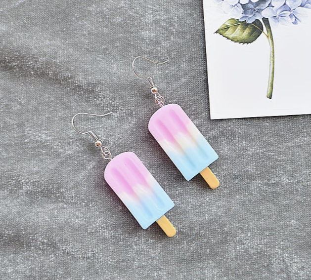 Soft pastel blue and pink popsicle earrings with playful summer design
