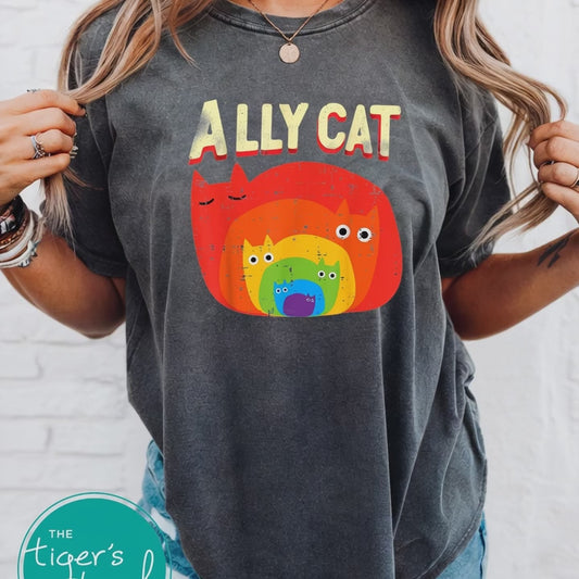 Woman wearing charcoal Ally Cat rainbow cat graphic t-shirt with distressed retro rainbow kitty design