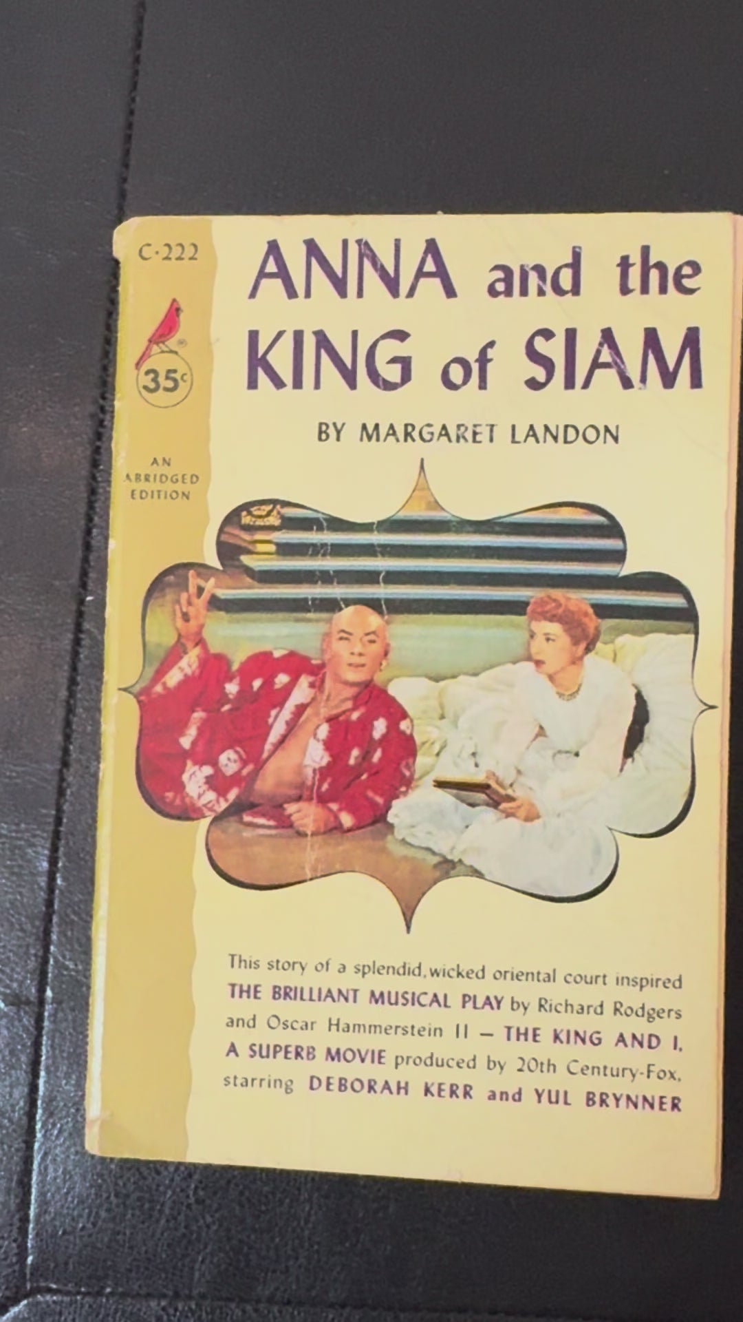 Vintage 1956 Cardinal edition paperback of Anna and the King of Siam by Margaret Landon featuring movie tie-in cover artwork