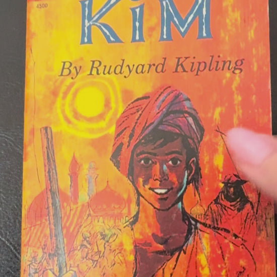 Vintage 1963 Dell Laurel Edition paperback of Kim by Rudyard Kipling featuring colorful adventure-themed cover artwork