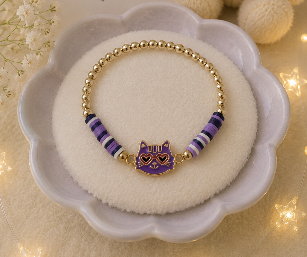 Purple kitten charm bracelet with gold-tone beads and striped purple accents