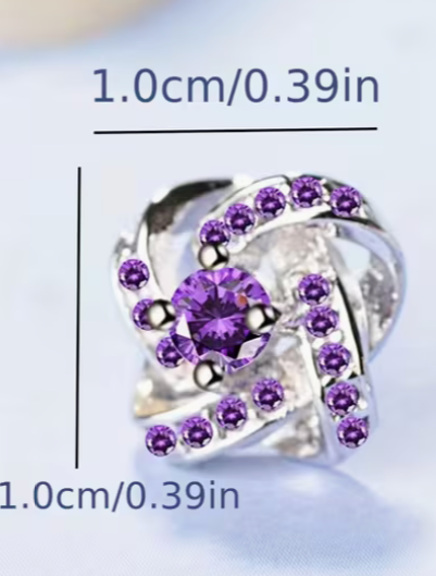 Small purple crystal stud earring showing size measurement and intricate knot design