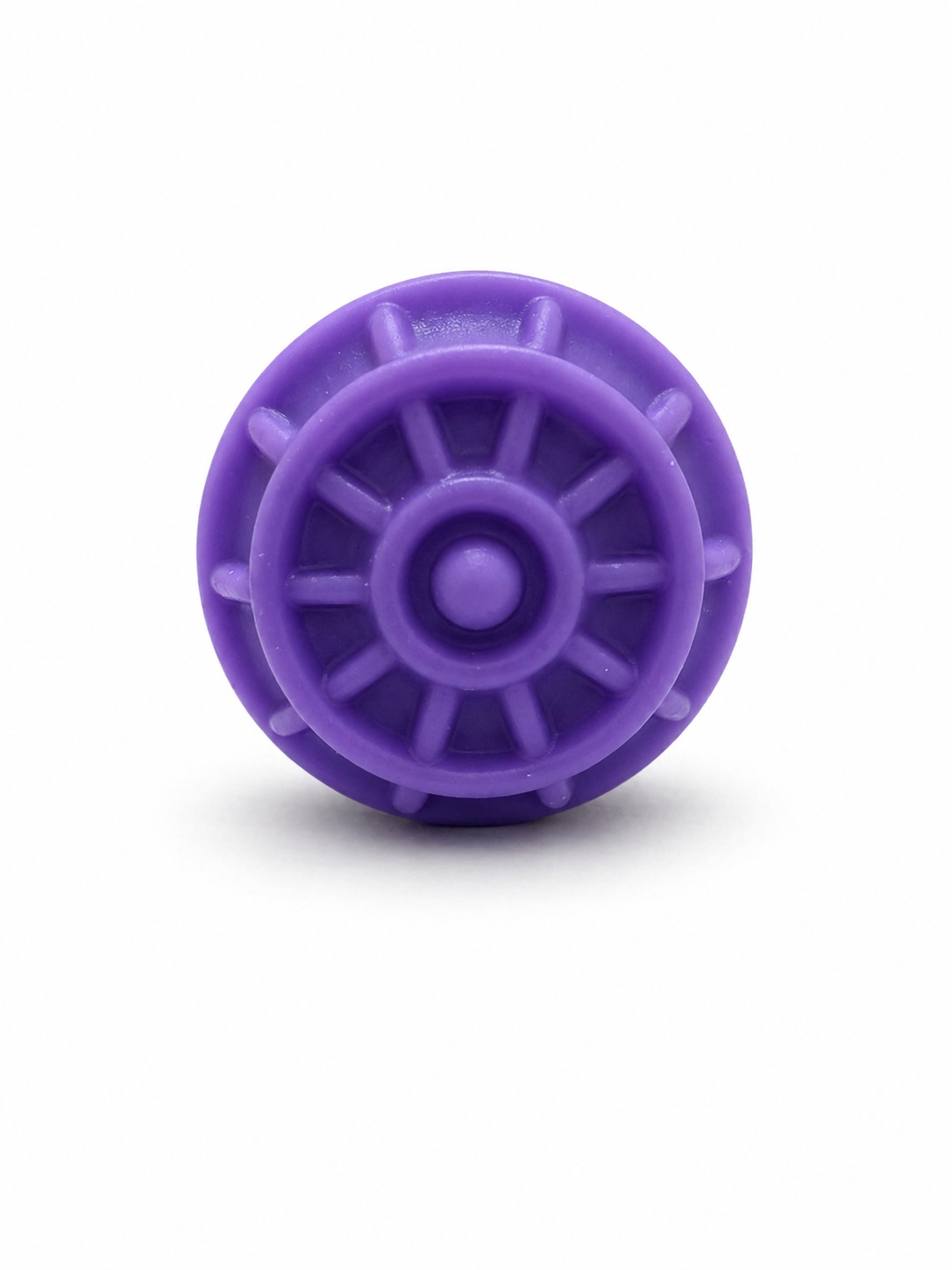 Purple wheel-style textured fidget ring with raised spokes