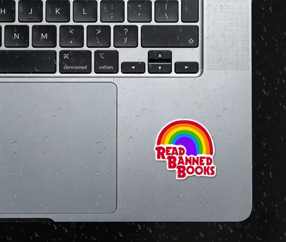 Read Banned Books rainbow sticker displayed on a laptop