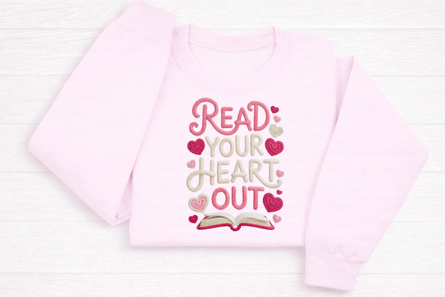 Pink shirt with 'Read Your Heart Out' text on a white background
