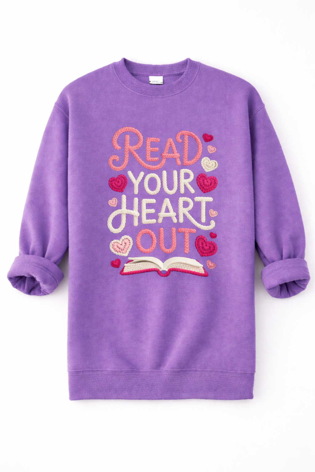 Purple sweatshirt with 'Read Your Heart Out' text and book graphic on a white background