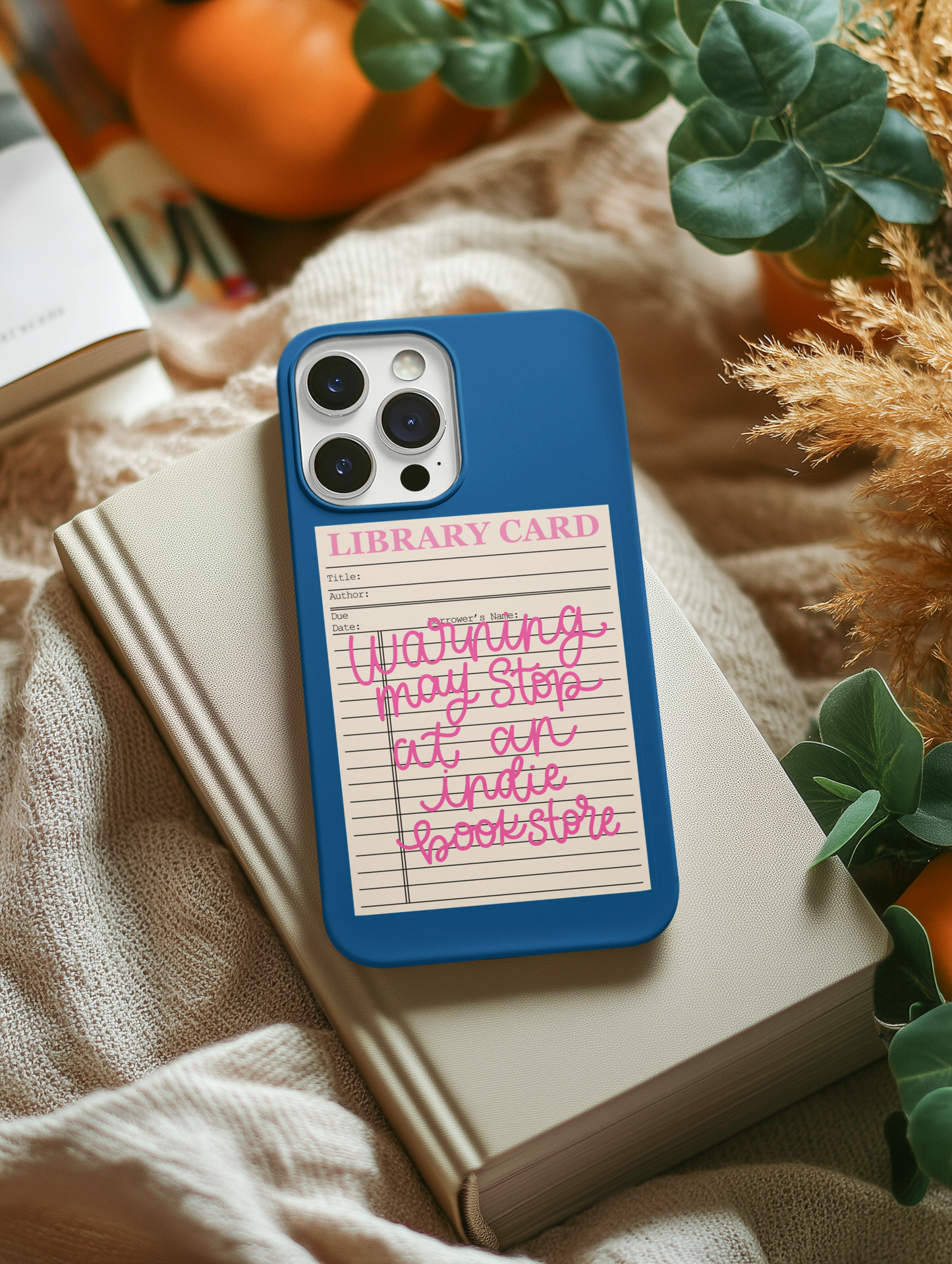 indie bookstore sticker on phone case styled with cozy book aesthetic