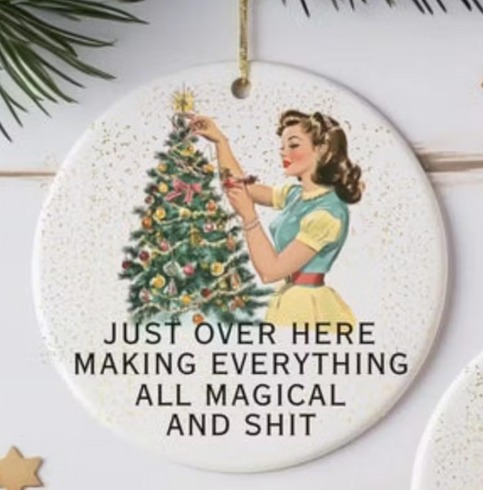 Acrylic ornament with retro woman decorating a Christmas tree and humorous magical and shit quote.