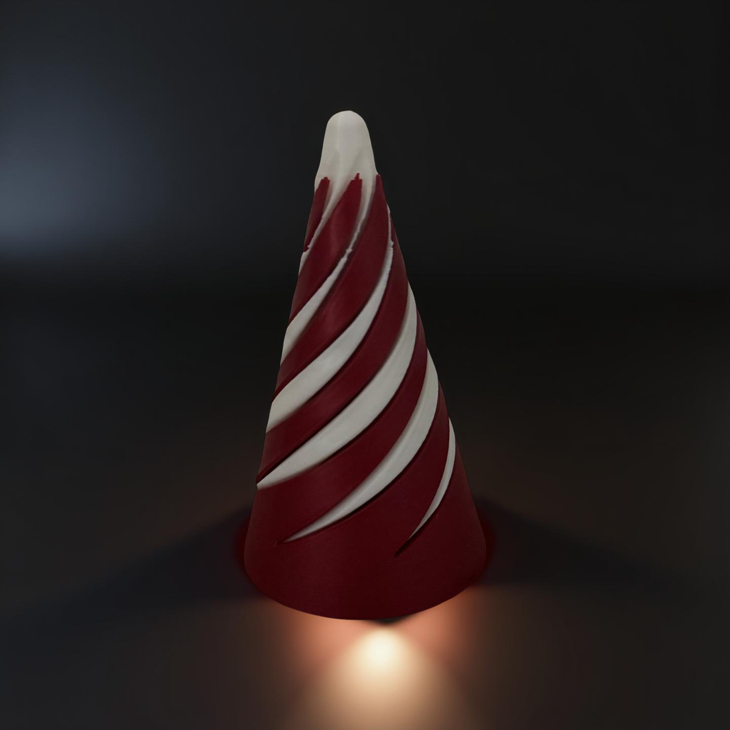 Three-wheel white and black 3D printed roller fidget toy resting on a smooth gray surface.