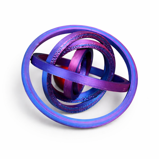 Round 3D printed articulated ring fidget spinner expanded into a colorful purple and blue gyro shape on a white background.