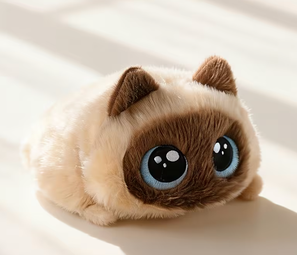 Siamese-style round cat plush toy with blue eyes