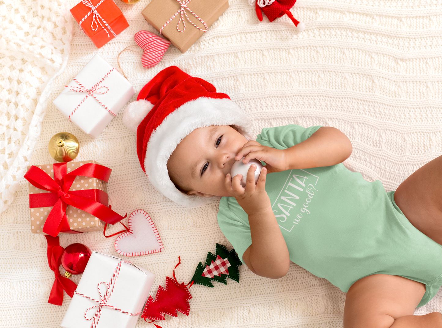 Mint green Christmas baby bodysuit with Santa We Good design, available in 12 months as a clearance item.