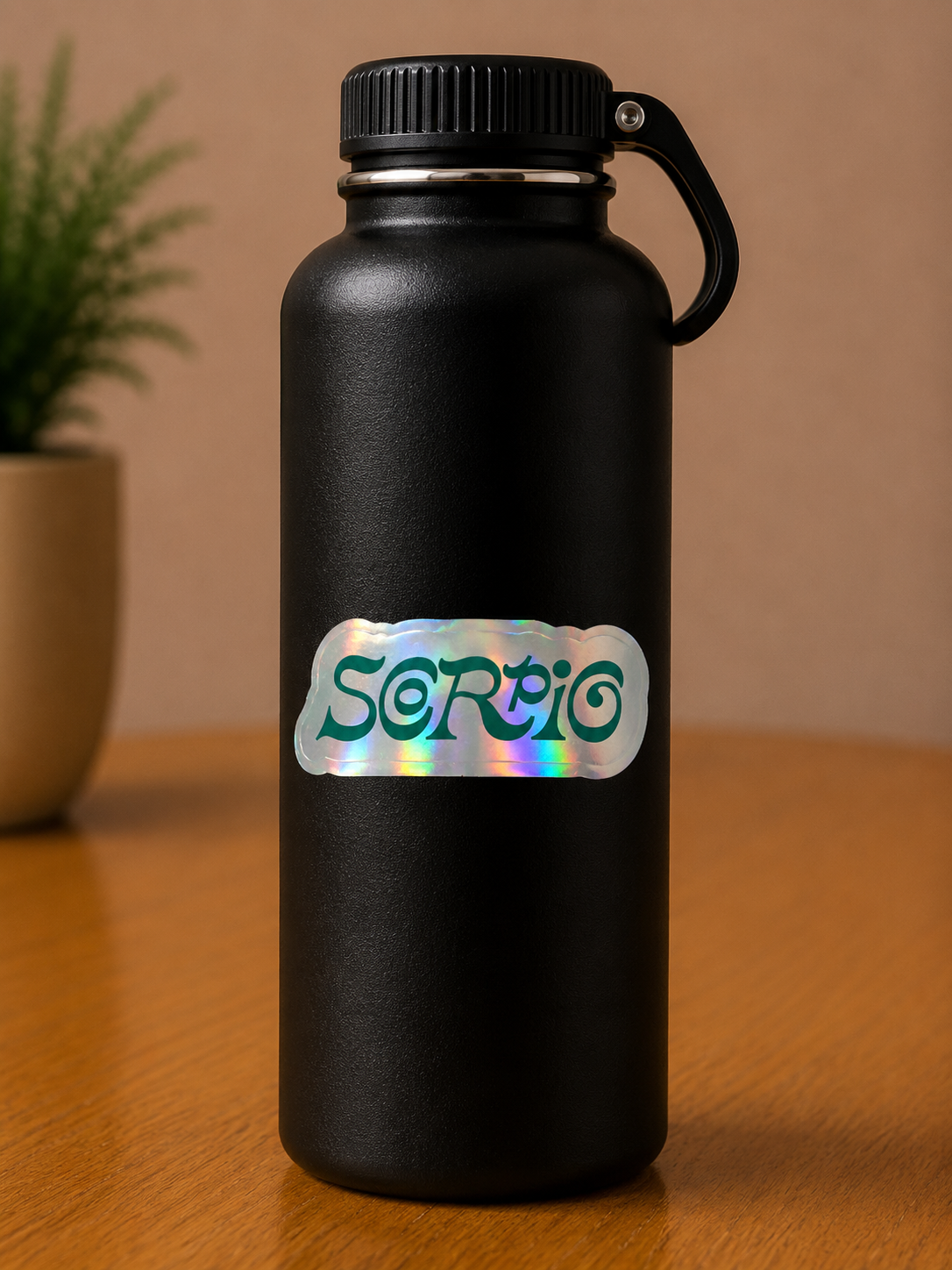 Scorpio holographic zodiac sign vinyl sticker on a black insulated water bottle with colorful astrology design.