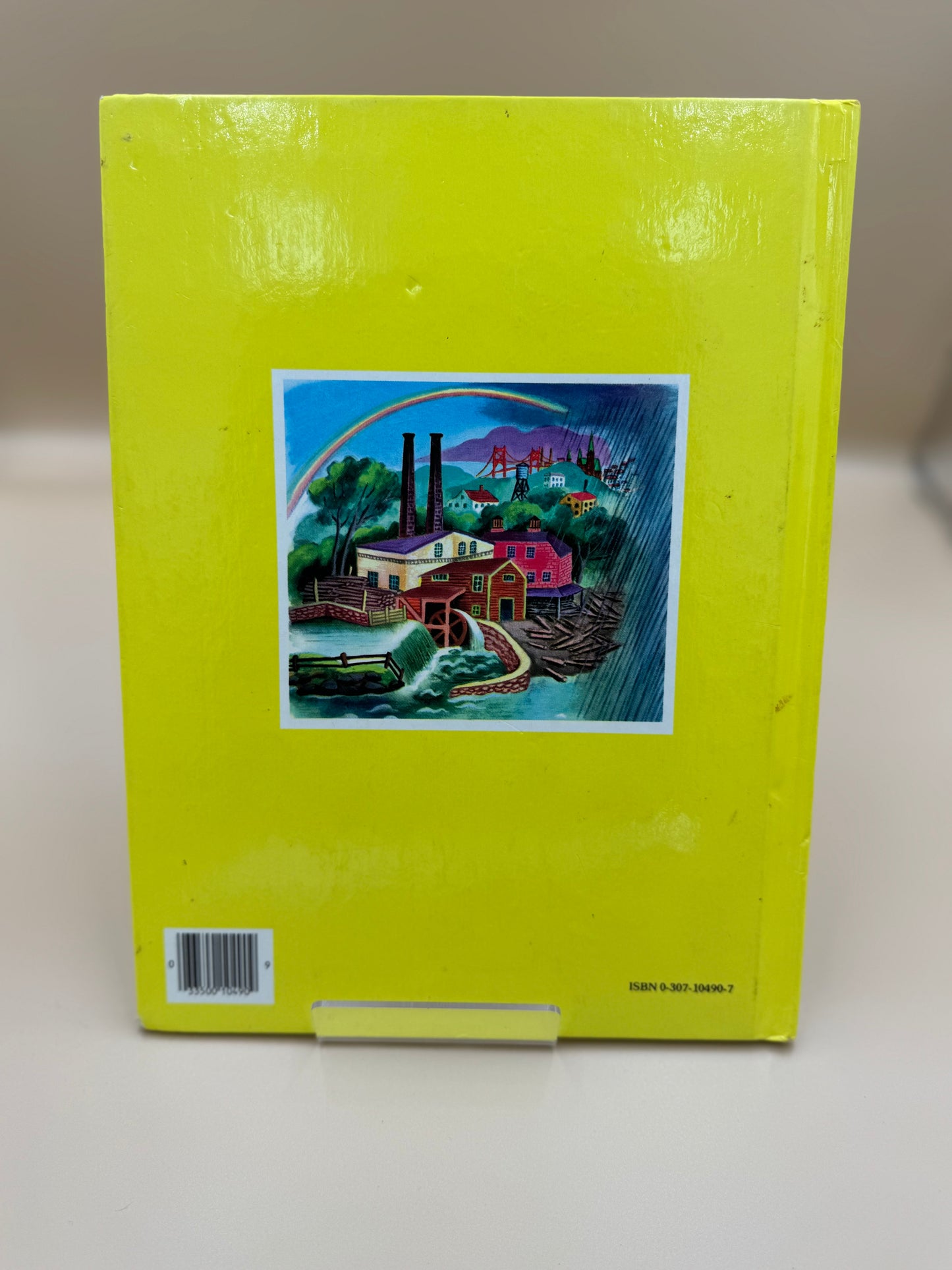 Yellow book with a colorful illustration on the cover