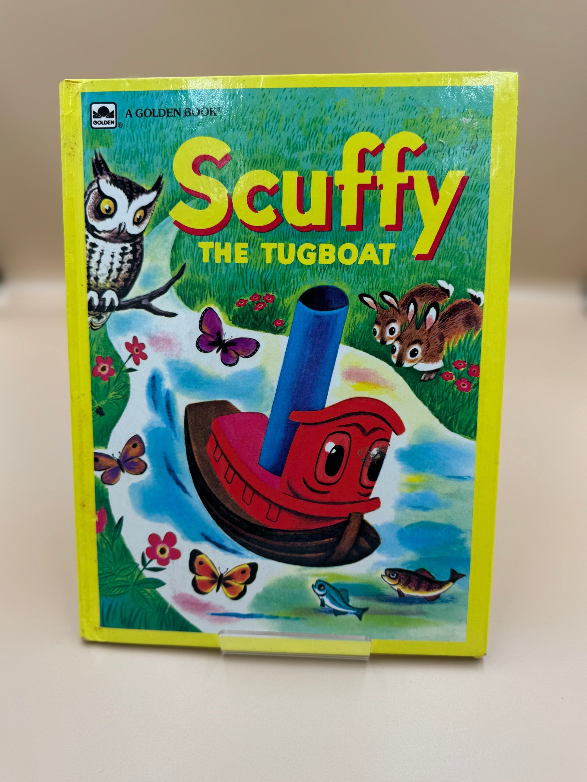 Book cover of 'Scuffy the Tugboat' with colorful illustration on a white background
