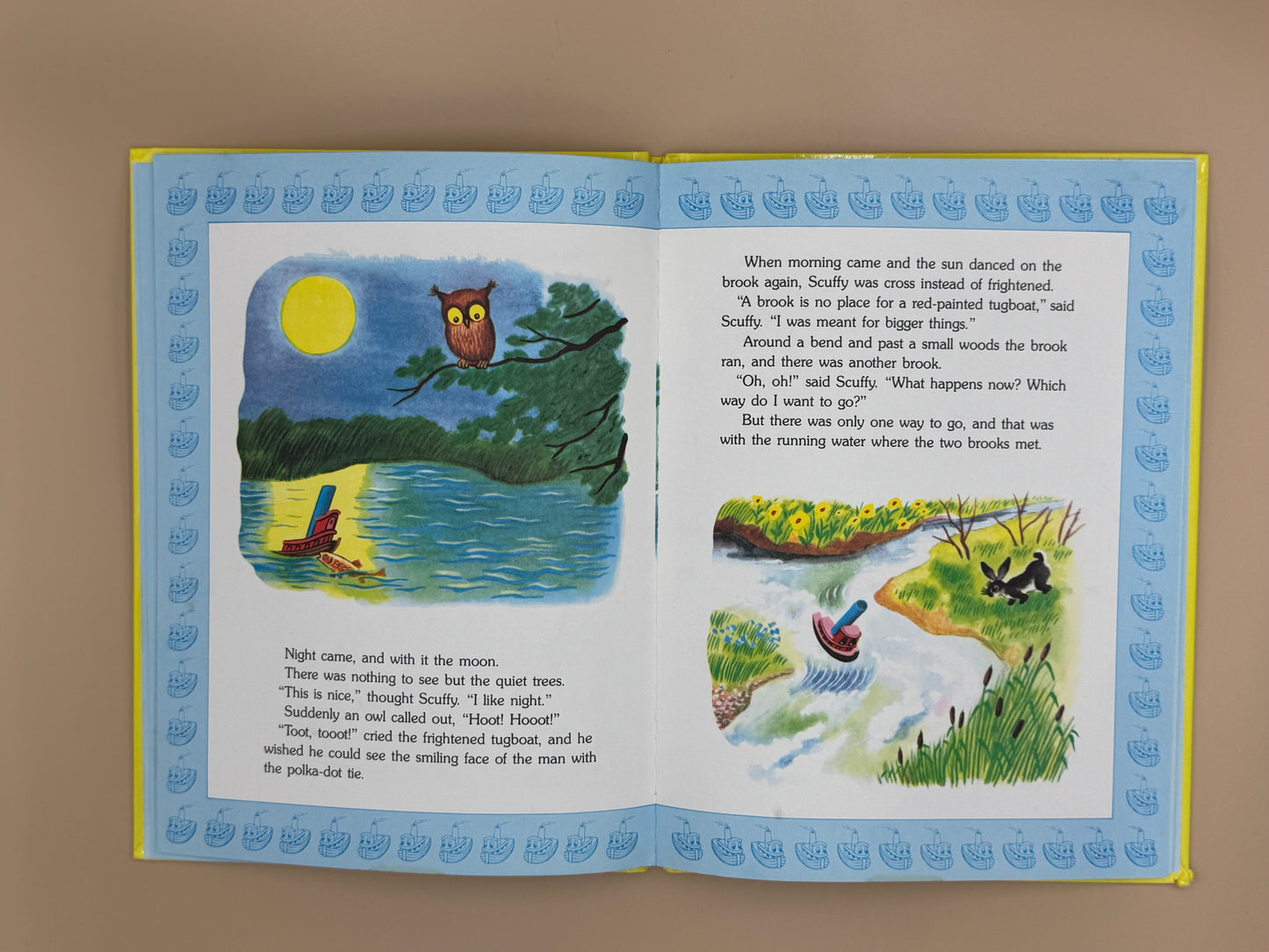 Open book with illustrations and text on a plain background