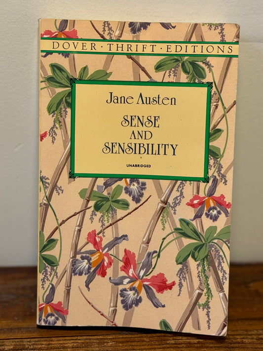 Paperback copy of Jane Austen’s Sense and Sensibility in good used condition, a classic romantic novel.