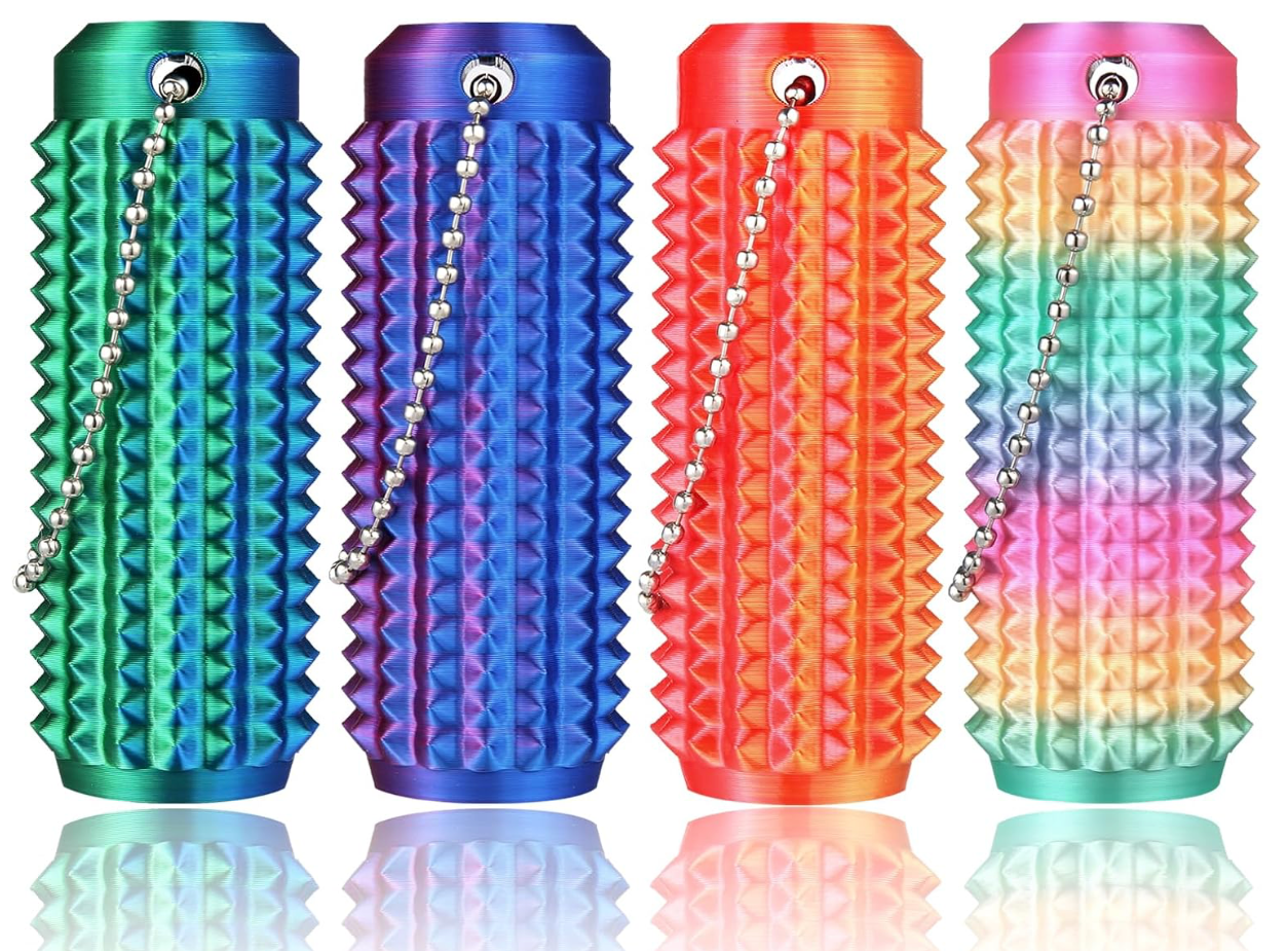 Four colorful textured keychains with chain links on a reflective surface.
