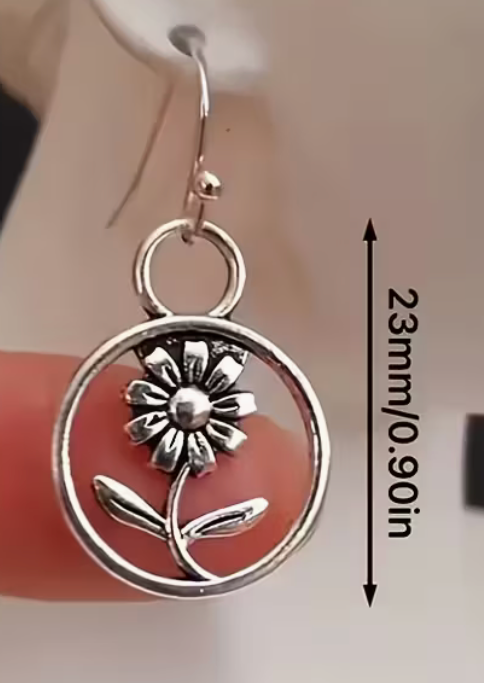 Silver-tone daisy drop earring showing the approximately 0.9 inch flower pendant size.