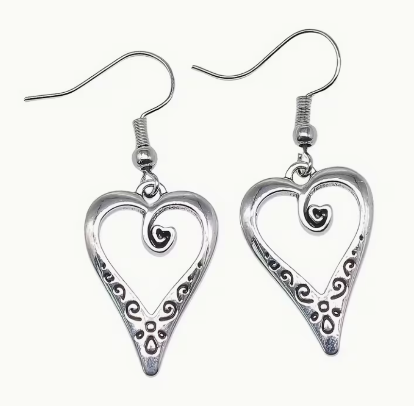 Silver-tone open heart dangle earrings with decorative scrollwork and approximately 1-inch heart charms