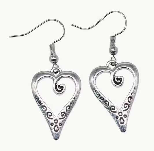 Silver-tone open heart dangle earrings with decorative scrollwork and approximately 1-inch heart charms