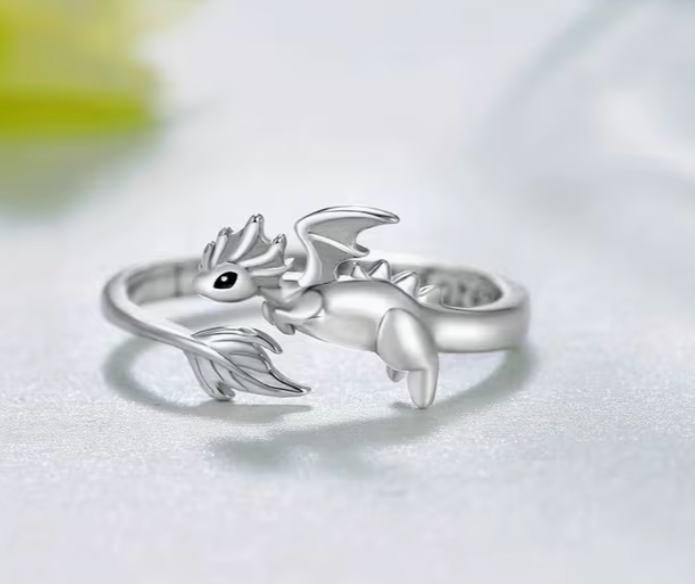 Silver tone adjustable dragon ring featuring a sculpted fantasy dragon with wings and curved tail design