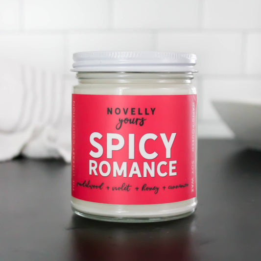 9 oz hand-poured soy candle titled Spicy Romance, featuring a bold fragrance for romantic and cozy settings.