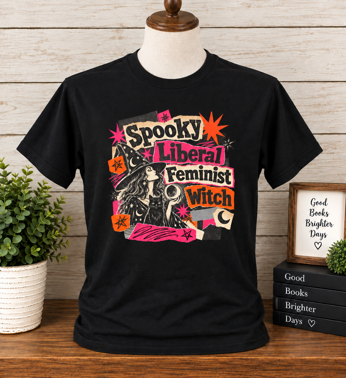 Black Spooky Liberal Feminist Witch T-shirt with retro witch, black cat, moon and stars graphic in pink orange and cream