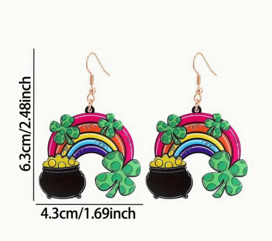 A pair of St. Patrick’s Day acrylic earrings featuring a colorful rainbow, a pot of gold, and a four-leaf clover, perfect for festive celebrations.