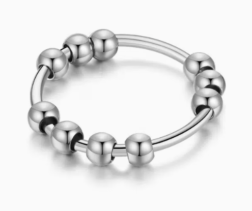 Polished stainless steel beaded spinner fidget ring with smooth rotating beads on a white background