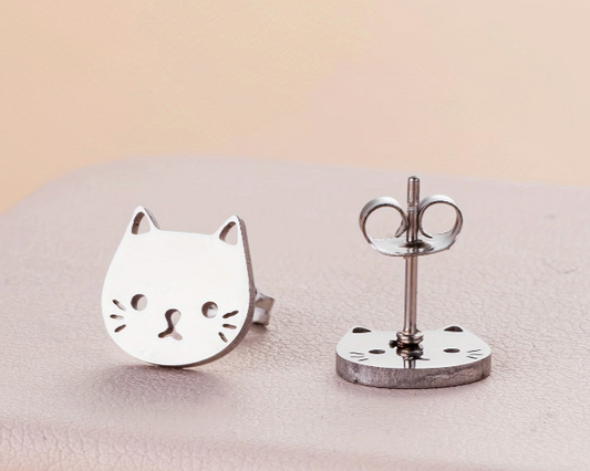 Small stainless steel cat face stud earrings with minimalist silver-tone design displayed on a neutral background