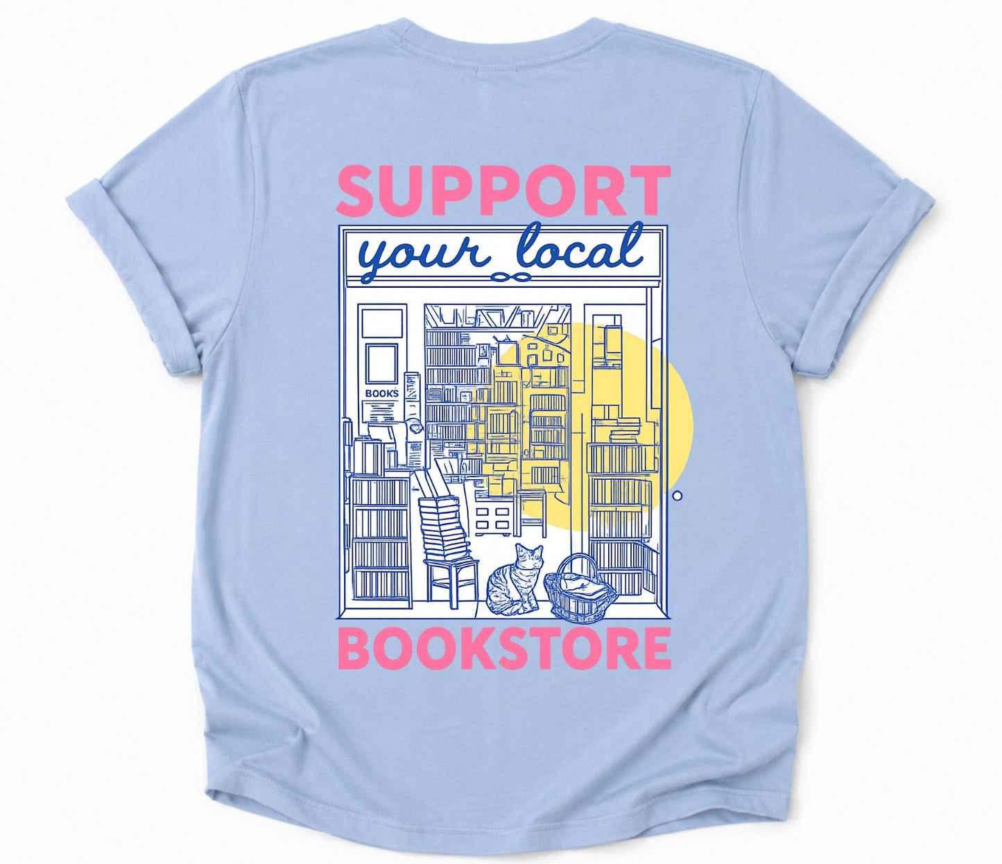 Back of light blue bookstore T-shirt featuring an illustrated bookstore storefront and bookstore cat.