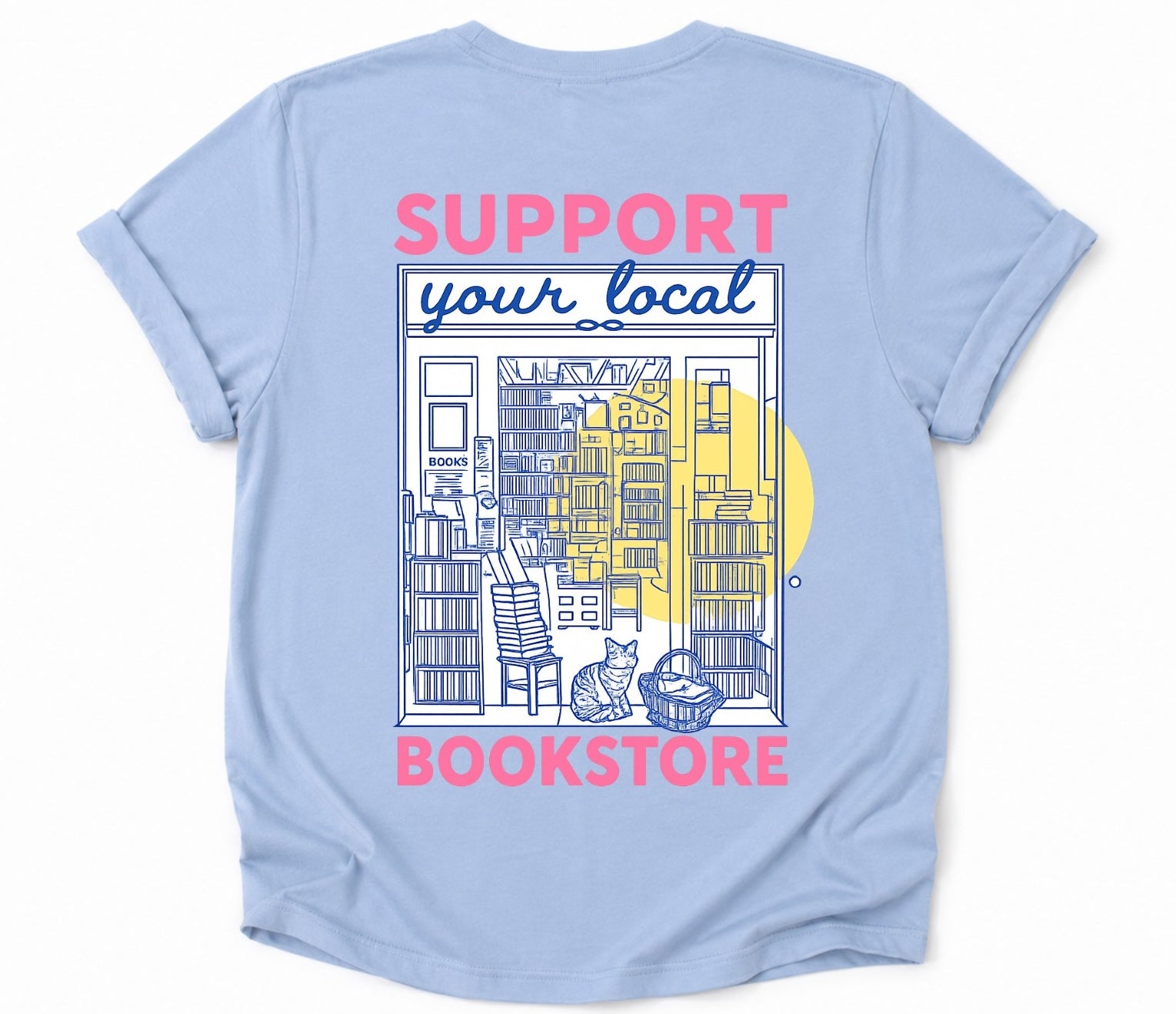 Back of light blue bookstore T-shirt featuring an illustrated bookstore storefront and bookstore cat.