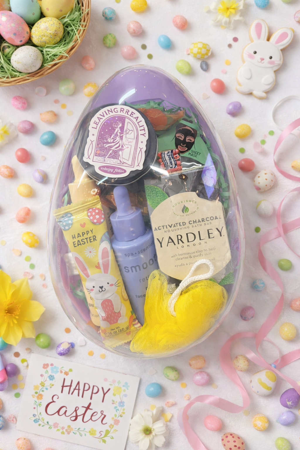 Clear reusable Easter egg filled with pampering spa products, bath items, and spring treats styled with pastel candy and Happy Easter card.