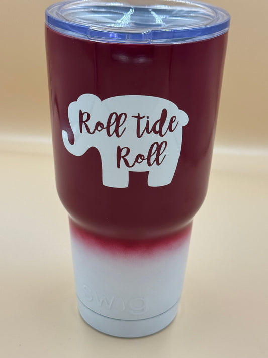 Maroon tumbler with 'Roll Tide Roll' design on a beige background