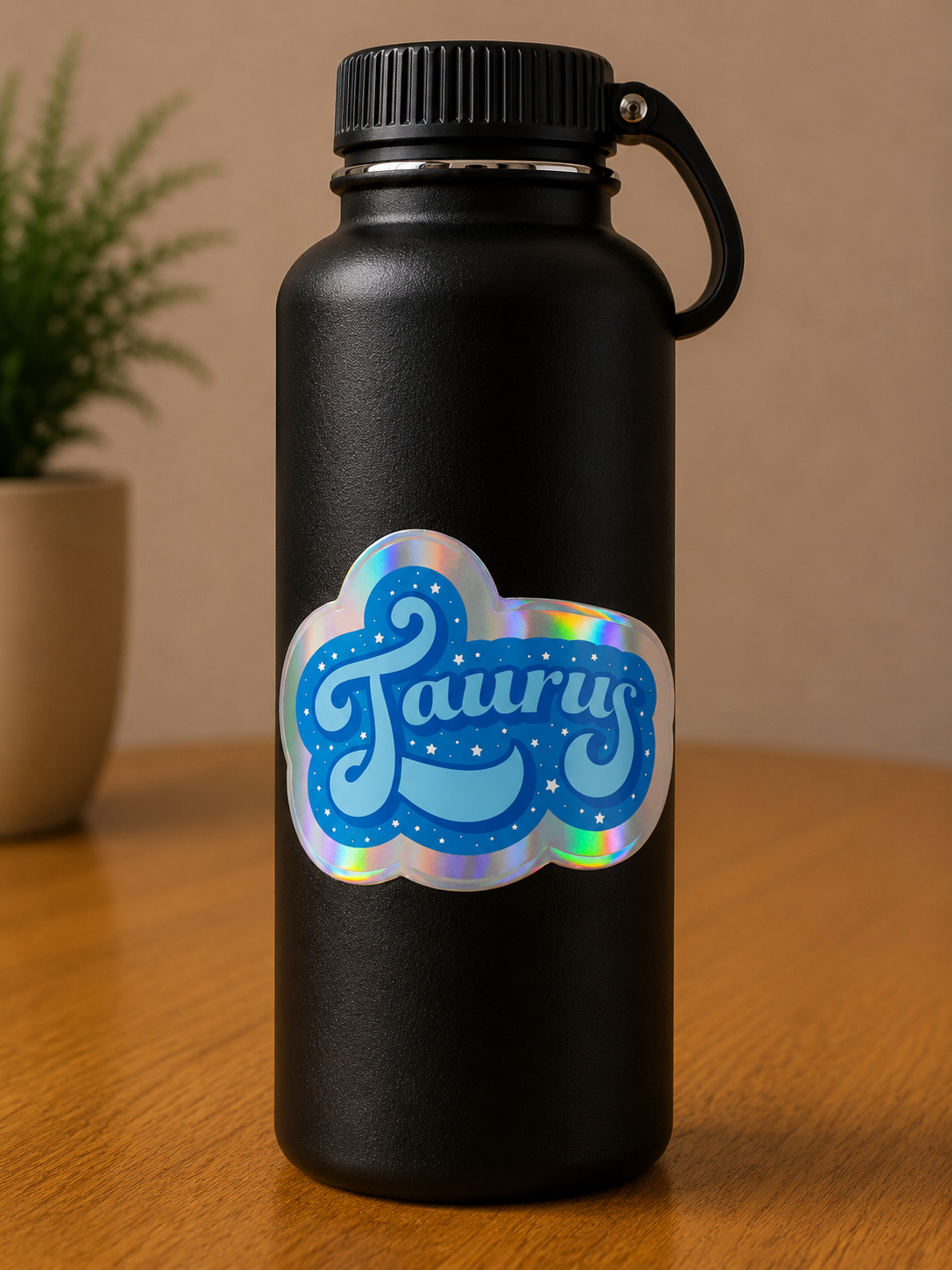 Taurus holographic astrology vinyl sticker displayed on a black water bottle with celestial-inspired artwork.