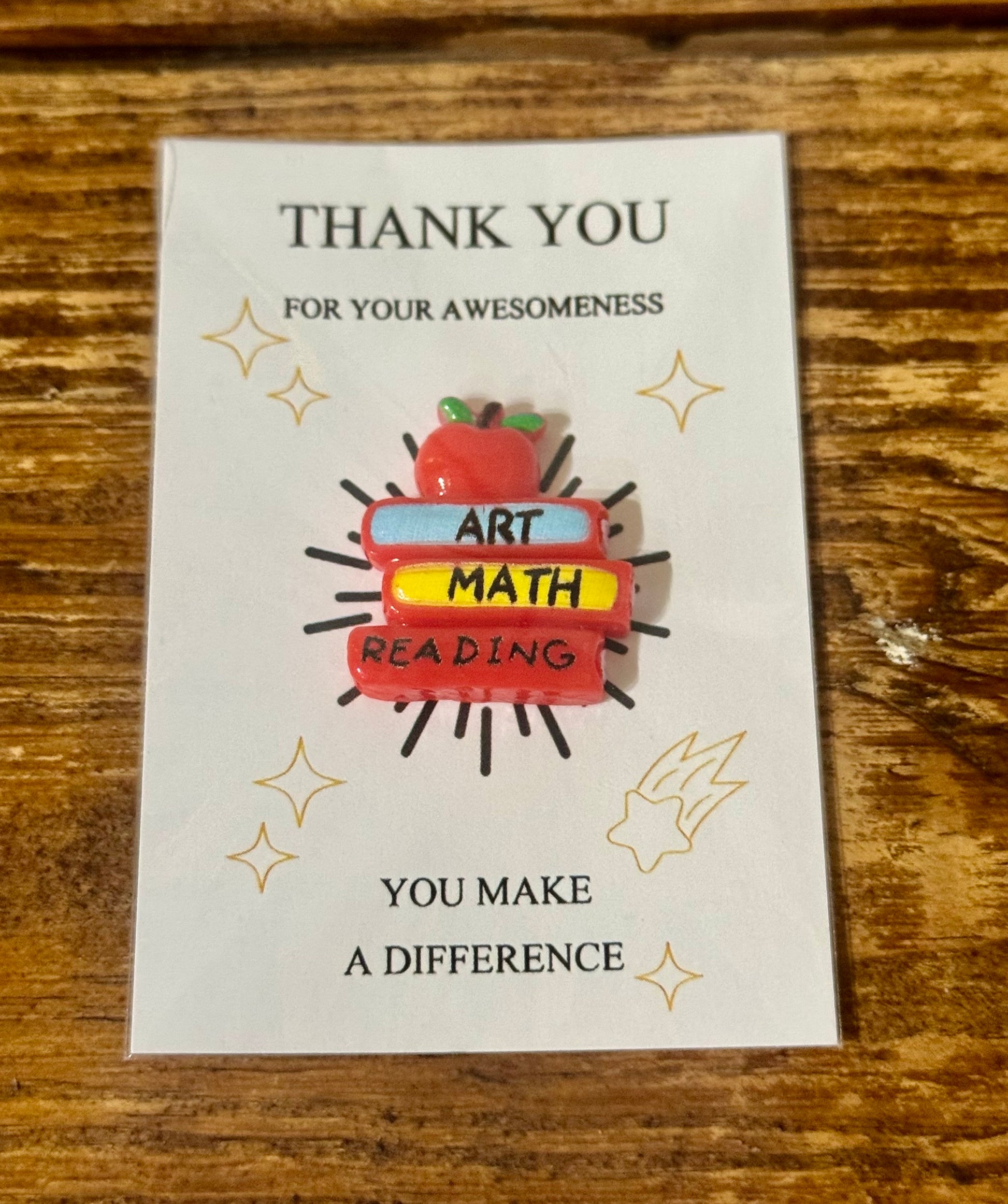  Pocket hug shaped like a stack of textbooks with the message You Make a Difference engraved—perfect for teacher appreciation.