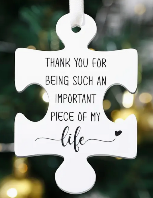 Plastic puzzle piece with engraved text that says Thank you for being such an important piece of my life—can be used as an ornament or a gift tag.