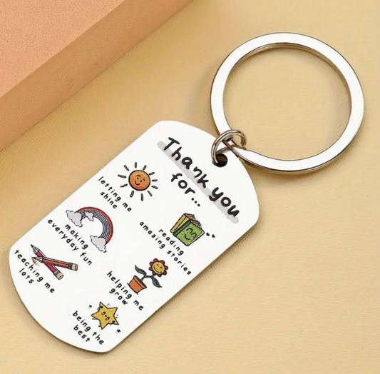 Metal keychain engraved with the phrase Teachers Plant Seeds That Grow Forever—a meaningful and lasting gift for educators.