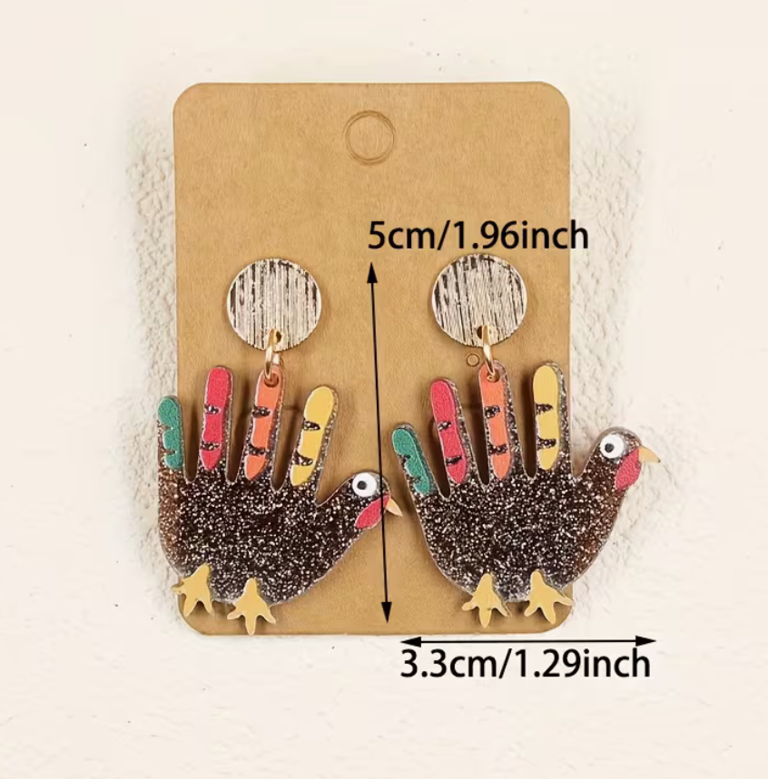 glitter handprint-style turkey earrings with size measurements shown