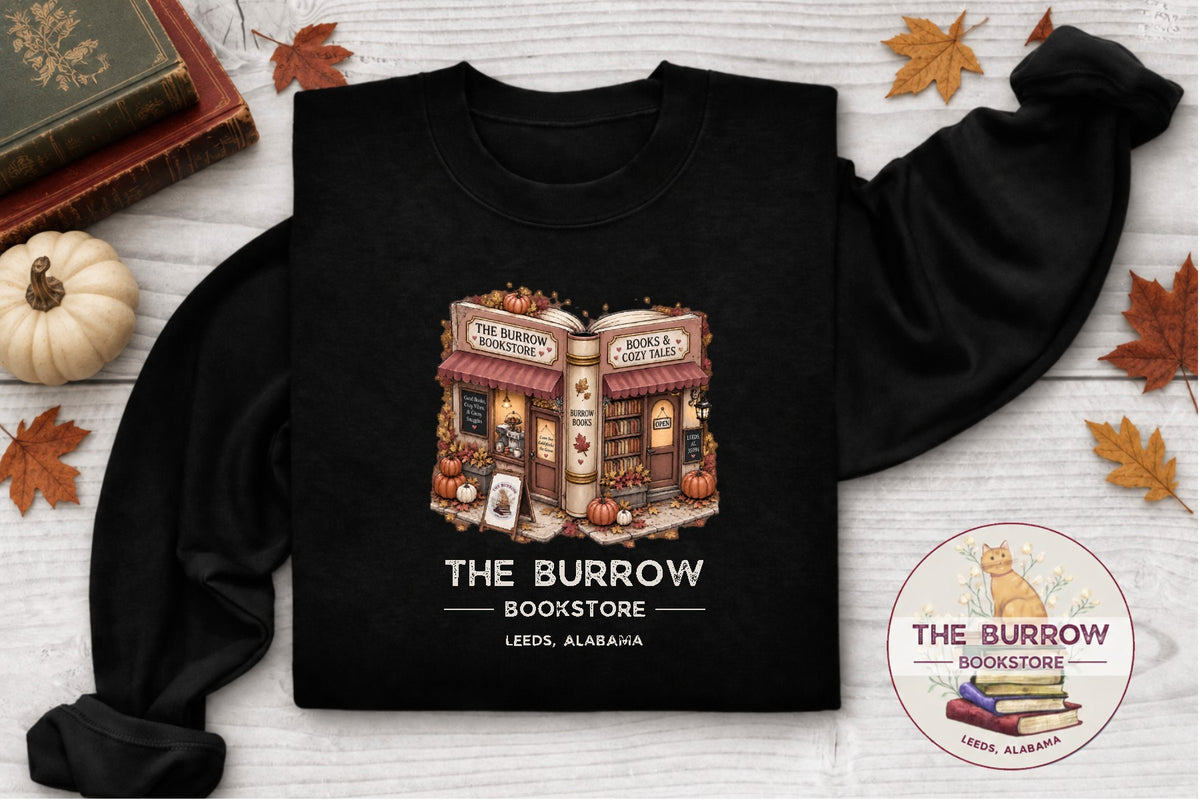 Black The Burrow Bookstore fall sweatshirt with cozy autumn bookstore and pumpkin design