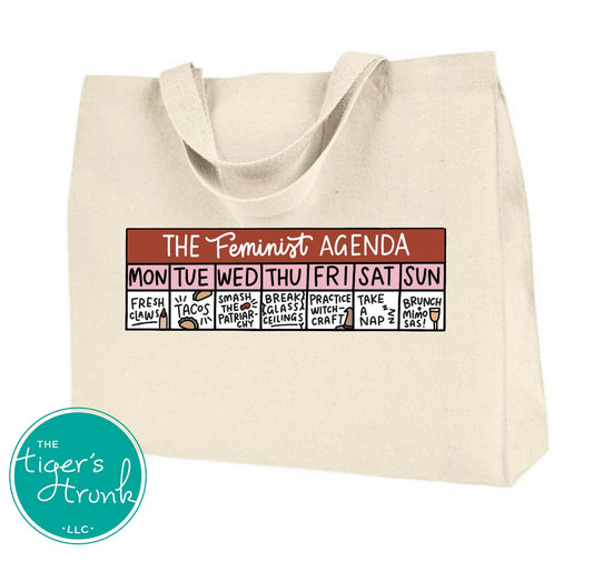 Canvas tote bag with the phrase The Feminist Agenda and a playful Monday to Sunday calendar printed on the front