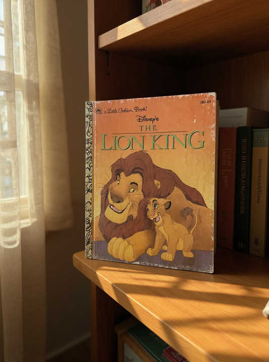 Front cover of The Lion King Little Golden Book by Justine Korman shown with bright illustrations of Simba, classic Disney children’s storybook