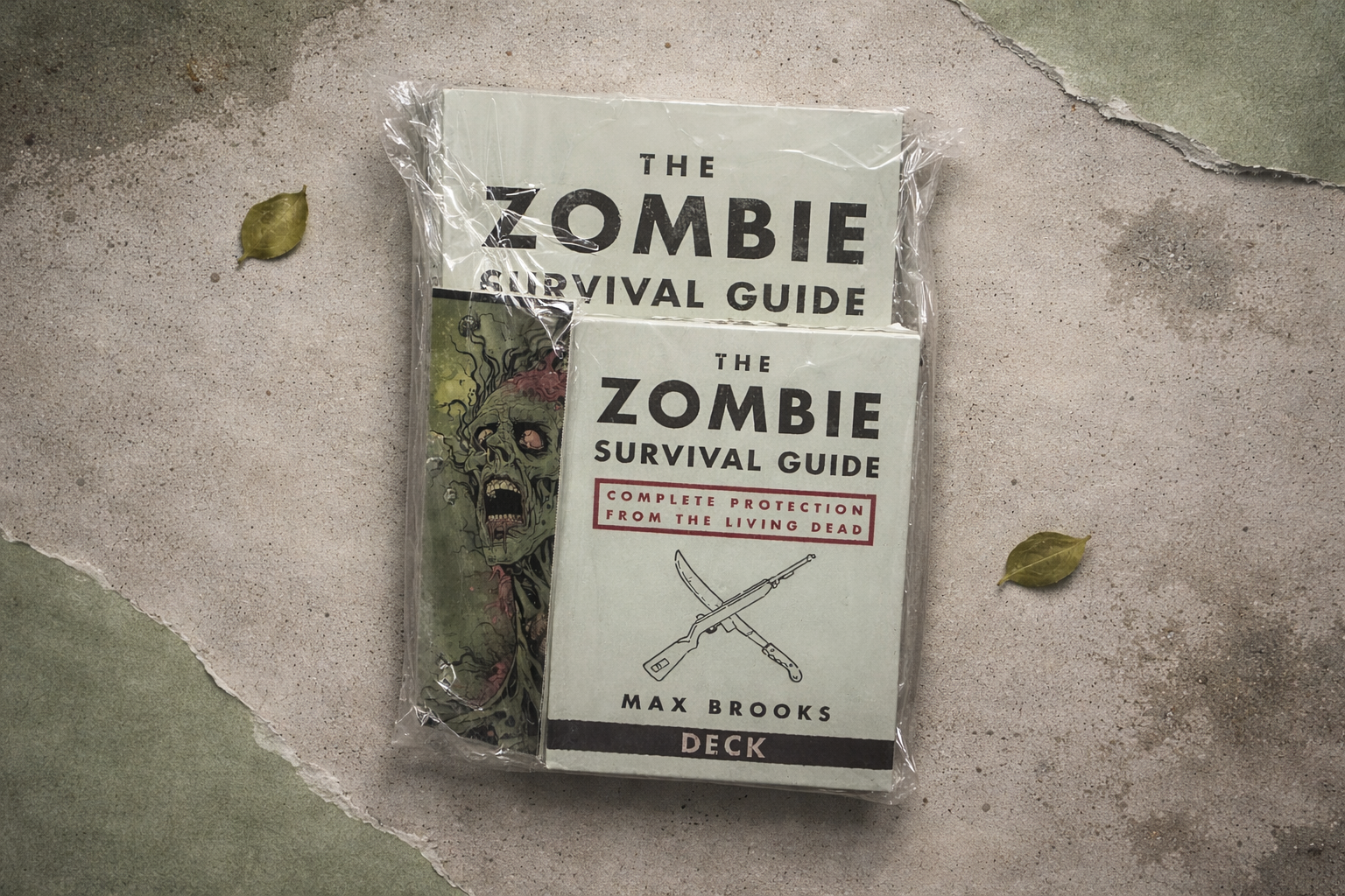 Zombie Survival Guide deck packaging on a textured surface